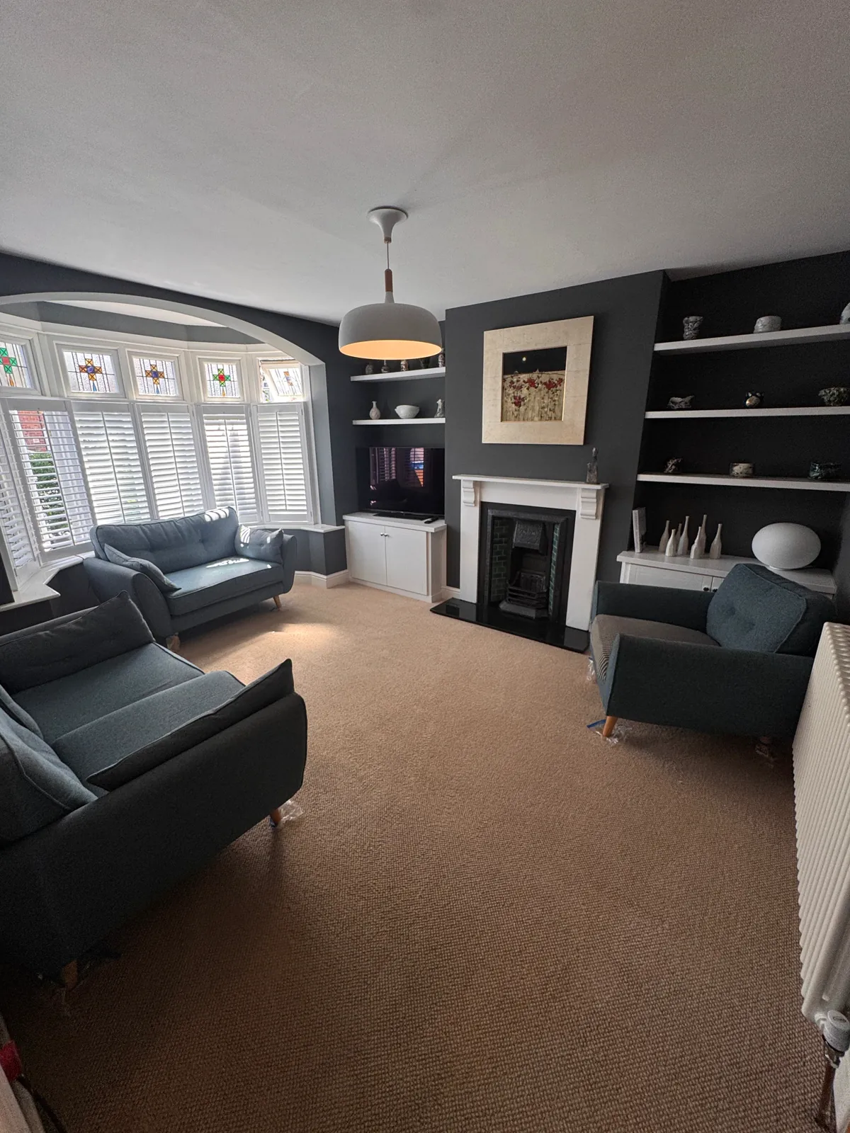 A living room with a freshly cleaned carpet