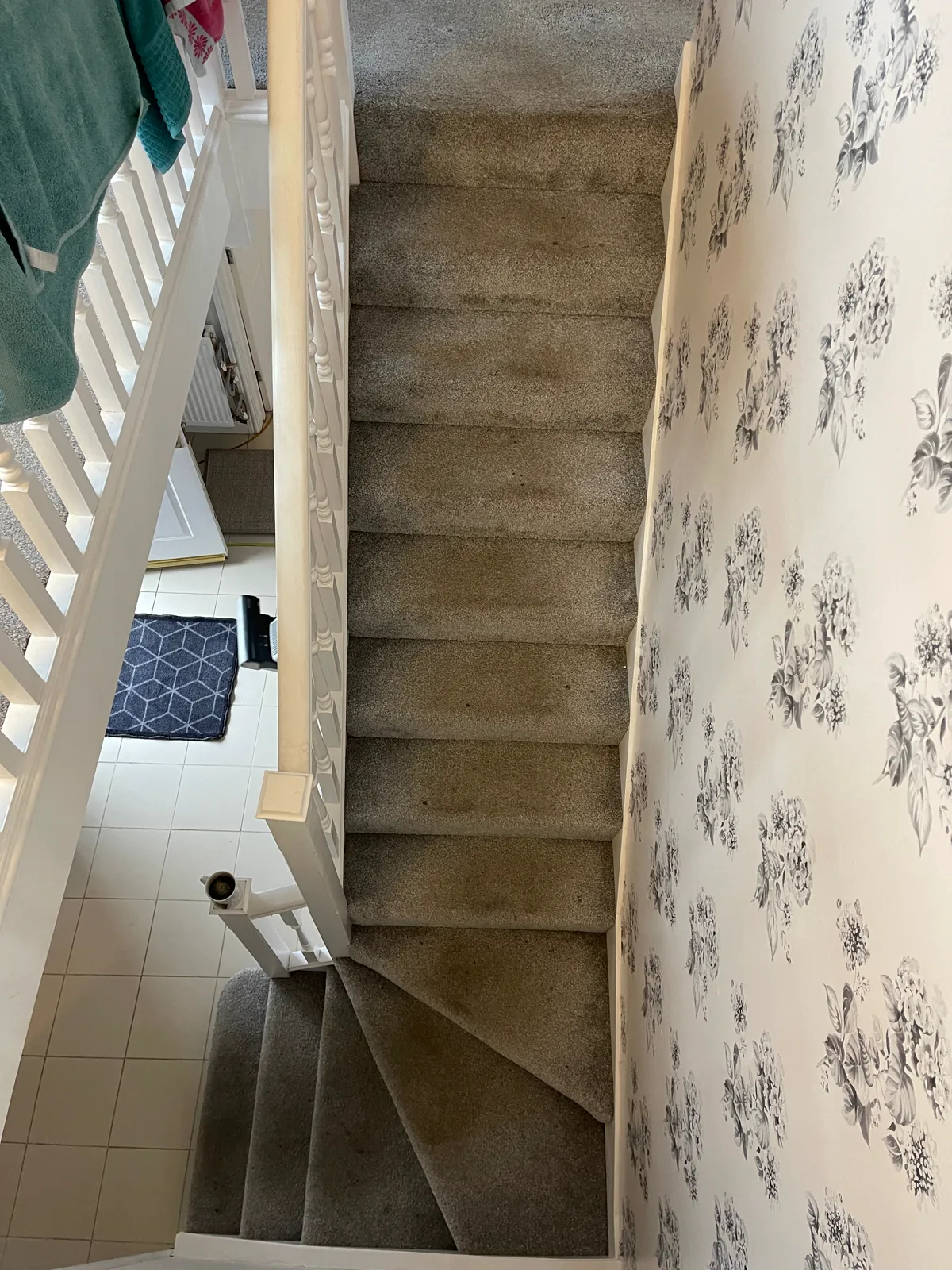 Grey stair carpet with visible dark marks before cleaning